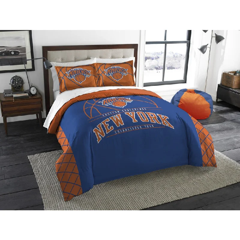 Down - filled comforters for supreme warmth and lightnessThe Northwest Company NBA New York Knicks Reverse Slam Full/Queen 3-piece Comforter Set Down - filled comforters for supreme warmth and lightnessThe Northwest Company NBA New York Knicks Reverse Slam Full/Queen 3-piece Comforter Set